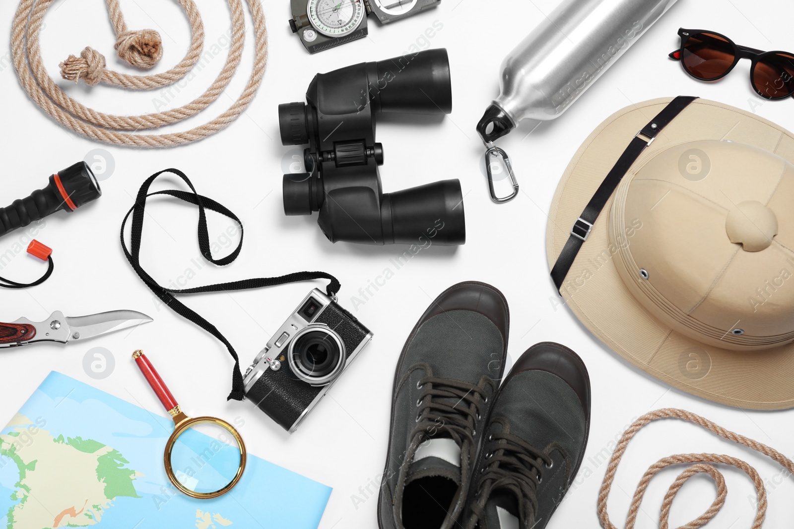 Photo of Flat lay composition with different safari accessories on white background