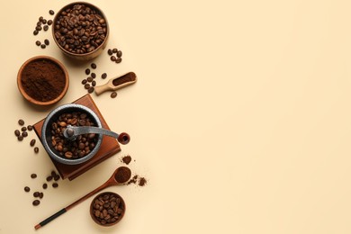 Flat lay composition with ground coffee and roasted beans on beige background, space for text