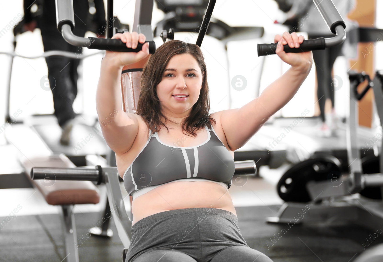 Photo of Overweight woman training in gym