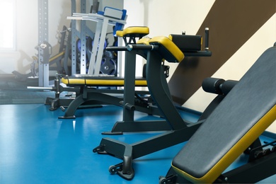 Interior of modern gym with new equipment