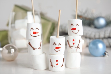 Photo of Funny snowmen made of marshmallows on white table