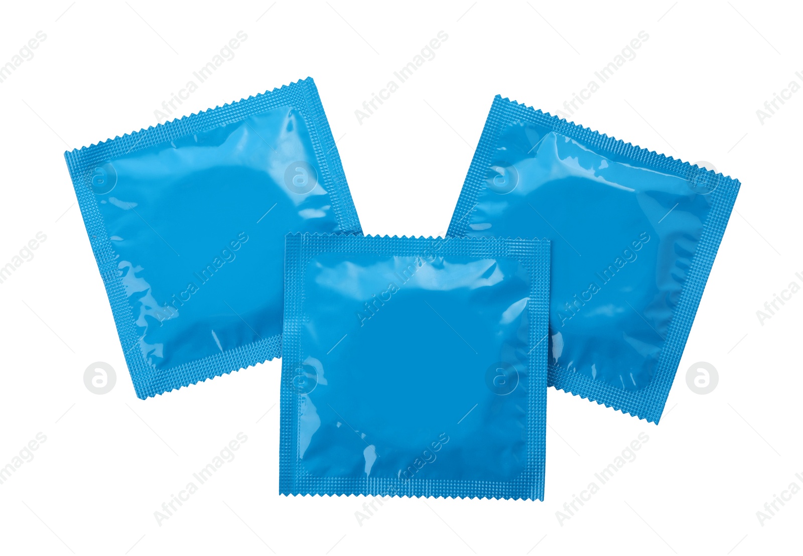 Photo of Condom packages isolated on white, top view. Safe sex