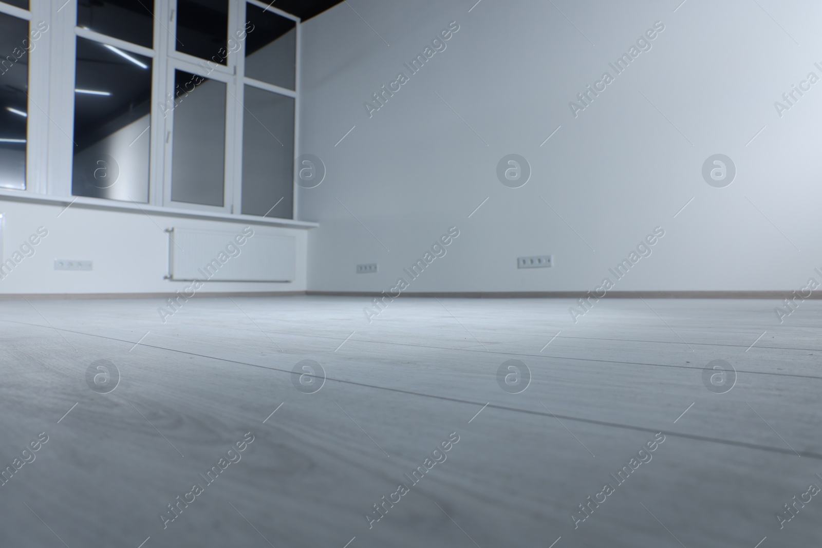 Photo of New empty room with clean windows and white walls