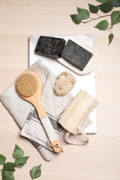 Flat lay composition with natural tar soap on white wooden table