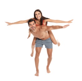 Young attractive couple in beachwear on white background