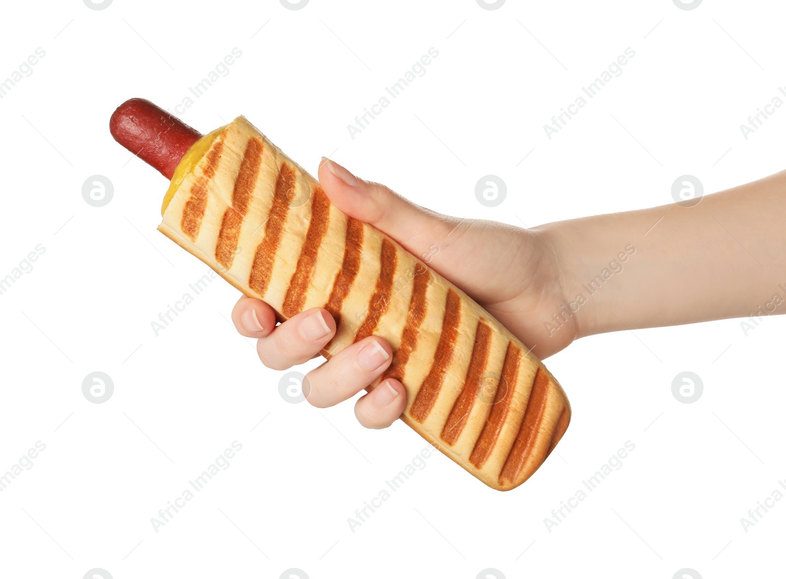 Photo of Woman holding delicious french hot dog on white background, closeup