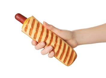 Photo of Woman holding delicious french hot dog on white background, closeup
