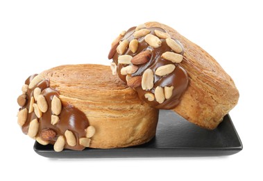 Photo of Round croissants with chocolate paste and nuts isolated on white. Tasty puff pastry