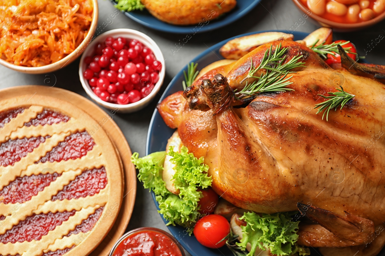 Photo of Delicious roasted turkey on festive table, closeup