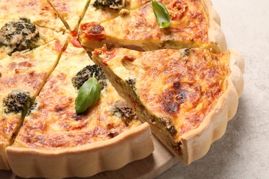 Photo of Delicious homemade vegetable quiche on table, closeup