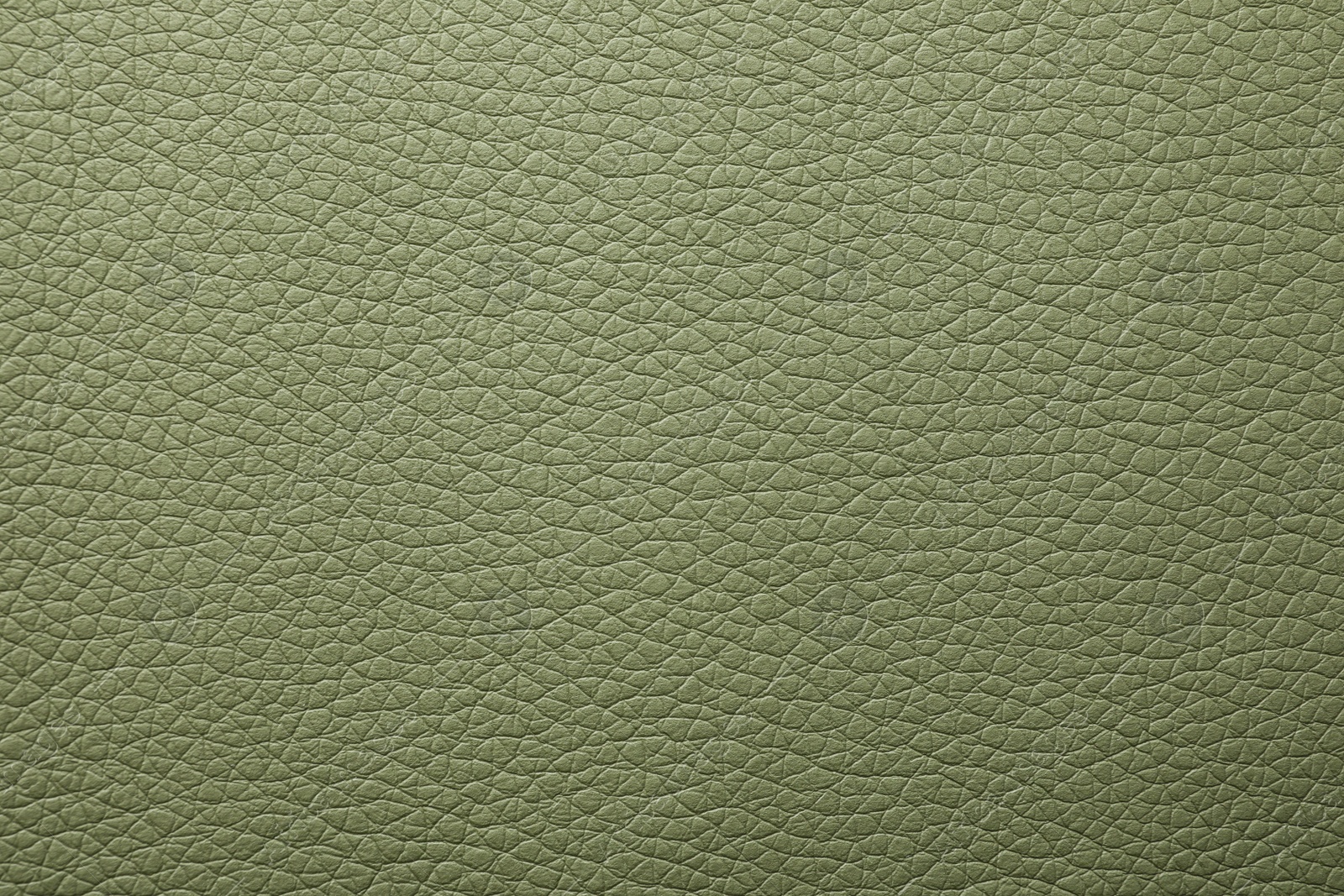 Photo of Texture of dark green leather as background, closeup