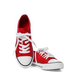 Photo of Pair of red classic old school sneakers on white background