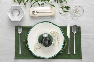 Elegant festive setting on white wooden table, flat lay