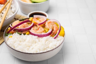 Photo of Delicious poke bowl with shrimps, rice and vegetables on white table, closeup. Space for text