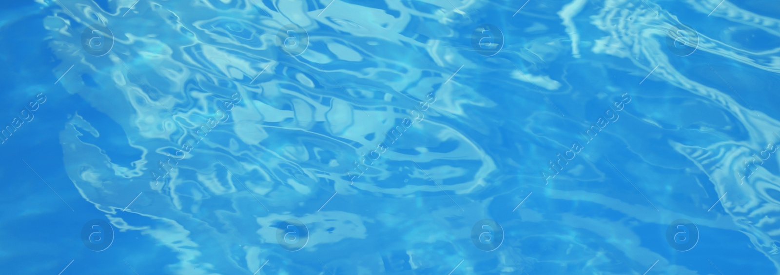Image of Surface of clean blue water in swimming pool, closeup. Banner design