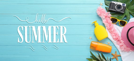 Image of Hello Summer. Flat lay composition with beach accessories on light blue wooden background, banner design