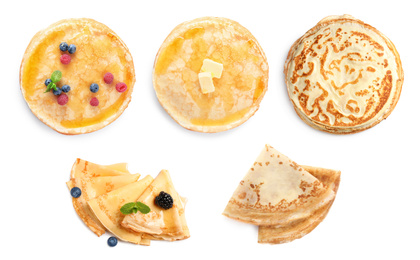 Image of Set of tasty thin pancakes on white background, top view. Banner design