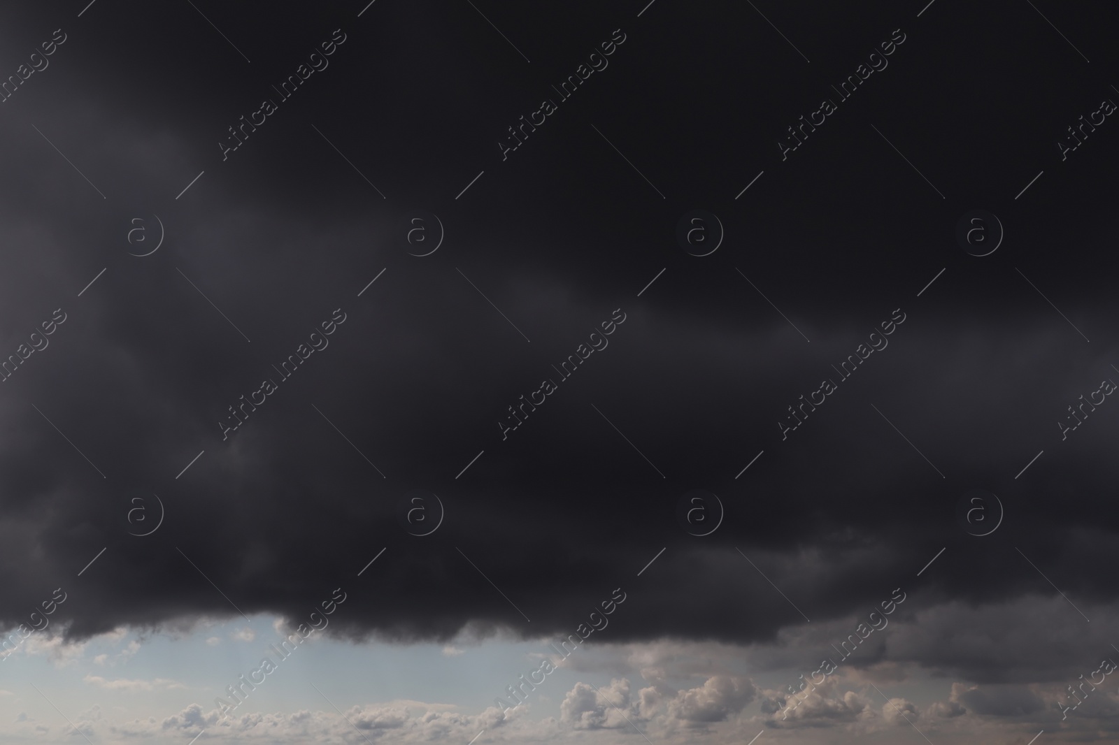 Photo of Sky with heavy rainy clouds on grey day