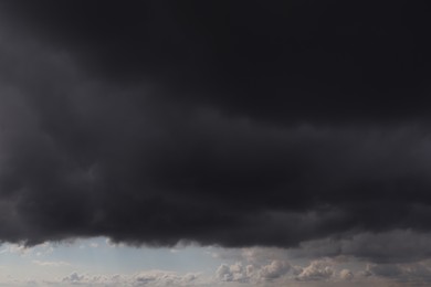 Sky with heavy rainy clouds on grey day