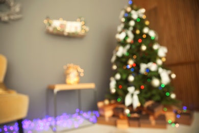 Photo of Blurred view of room with beautiful Christmas tree