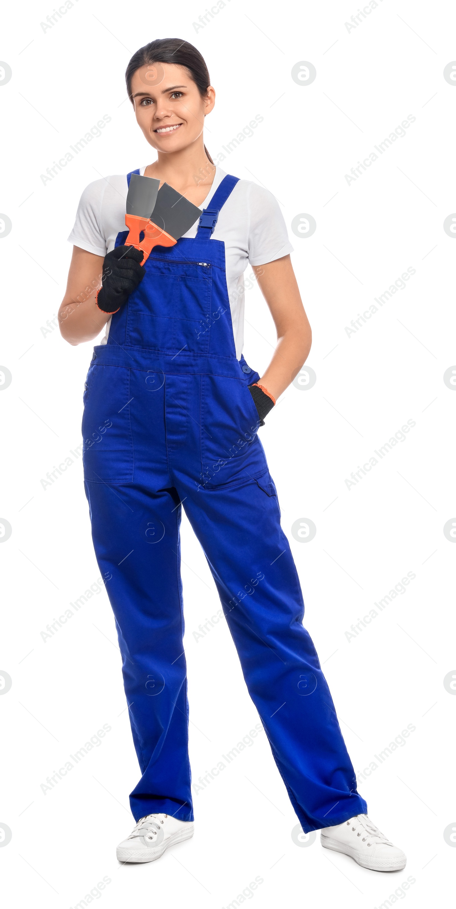 Photo of Professional worker with putty knives on white background