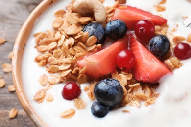 Bowl with yogurt, berries and granola, closeup