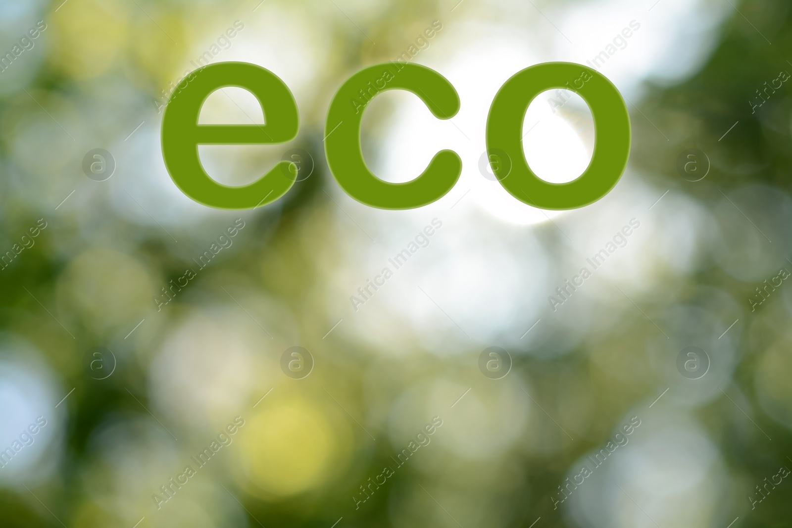 Image of Word ECO on blurred green background. Bokeh effect