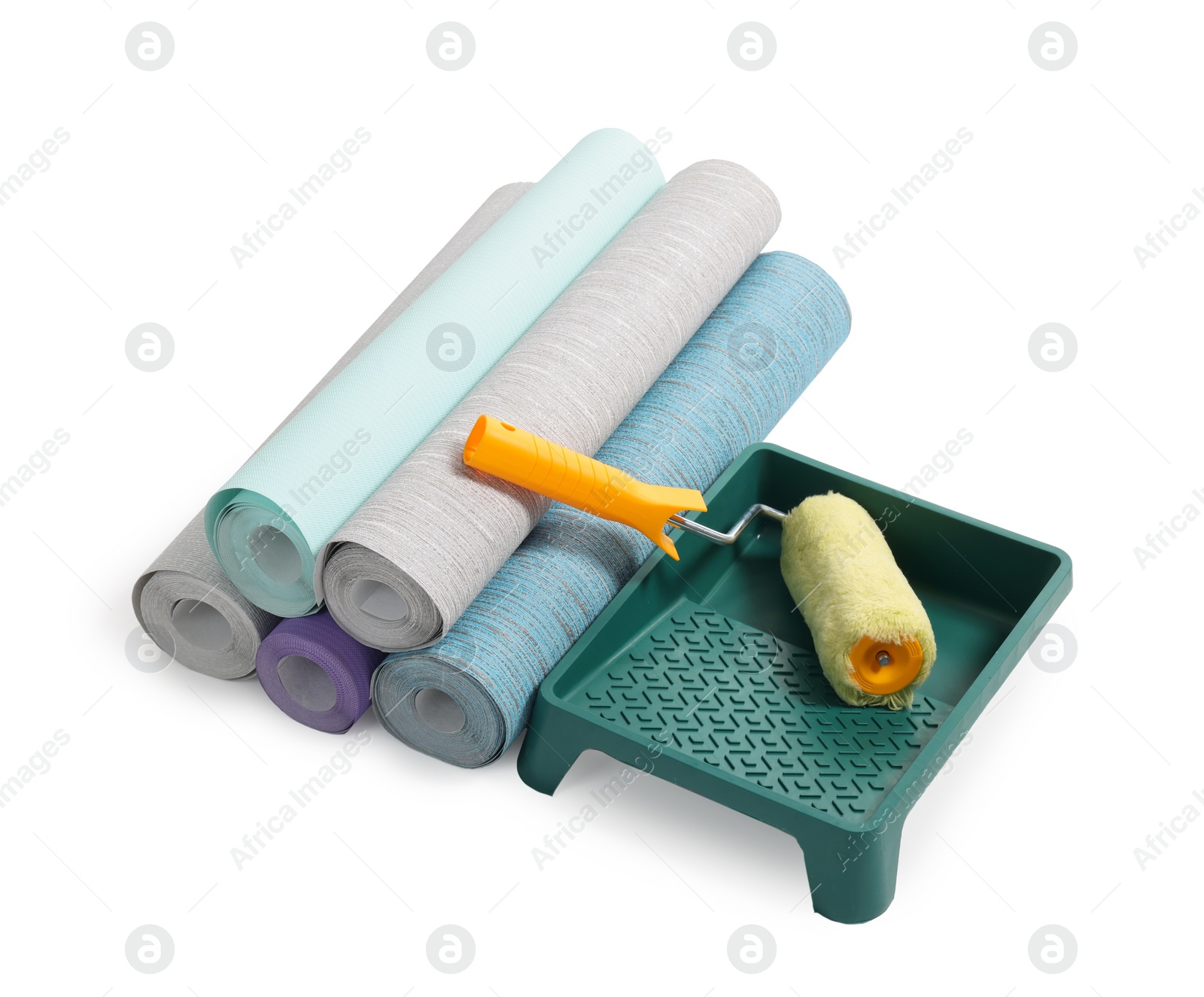 Photo of Different wallpaper rolls, roller and tray isolated on white