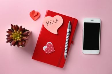Photo of Flat lay composition with stationery, note HELP and smartphone on color background. Space for text