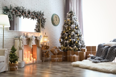 Photo of Stylish interior of living room with decorated Christmas tree