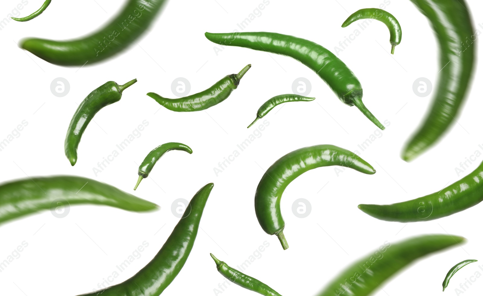 Image of Green chili peppers falling on white background 