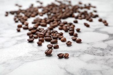 Coffee beans on marble background