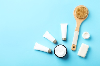 Photo of Flat lay composition with body care products and space for text on color background