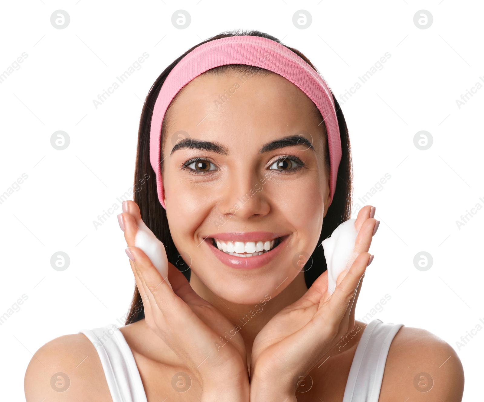 Photo of Young woman applying cosmetic product on white background. Washing routine