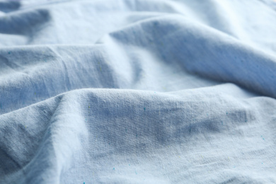 Texture of light blue fabric as background, closeup