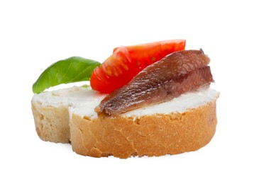 Delicious sandwich with cream cheese, anchovy, tomatoes and basil on white background