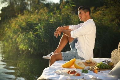 Photo of Man spending time on pier at picnic