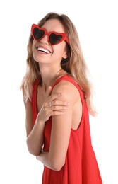 Photo of Young beautiful woman wearing heart shaped glasses on white background