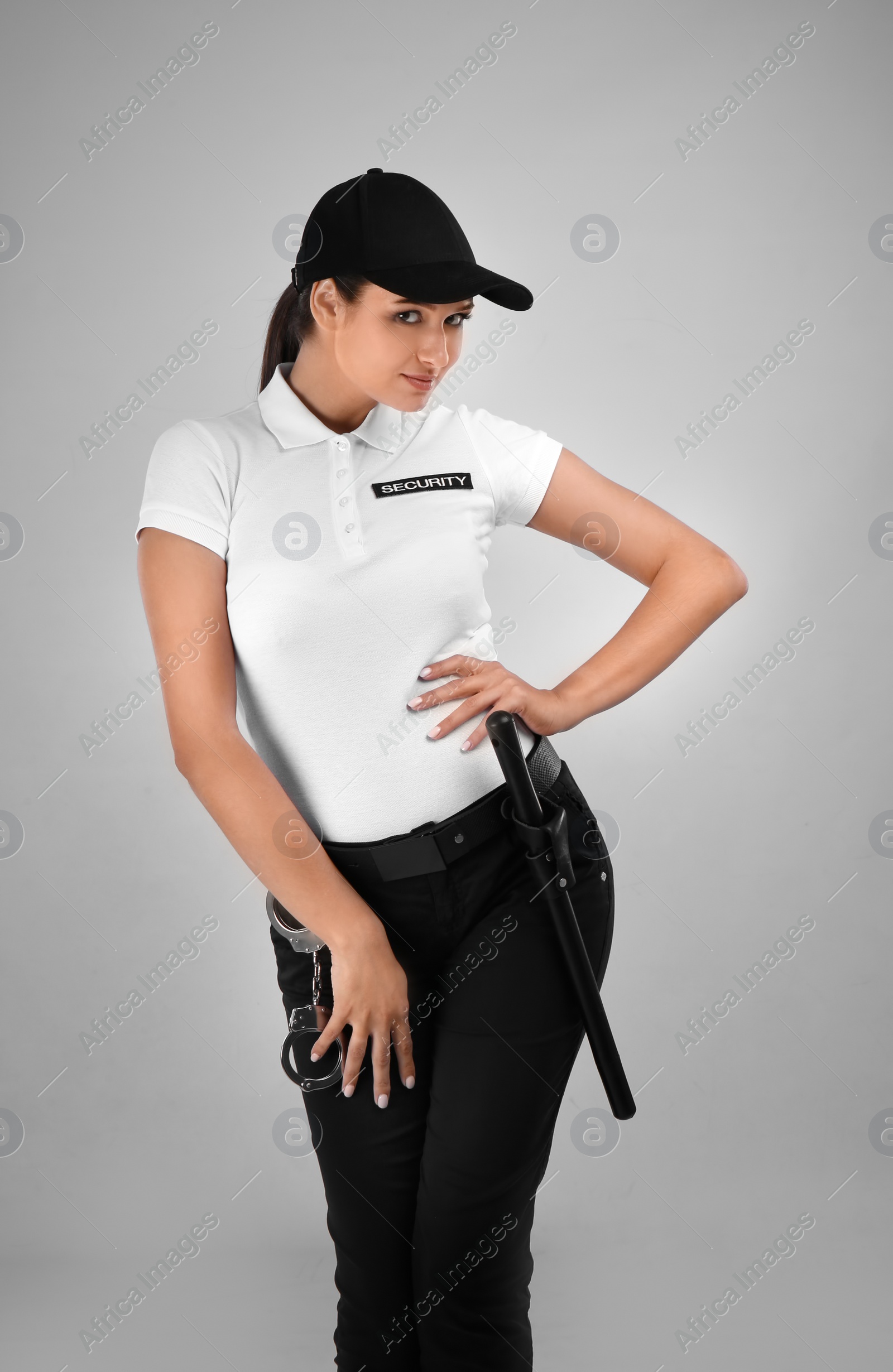 Photo of Female security guard in uniform on color background