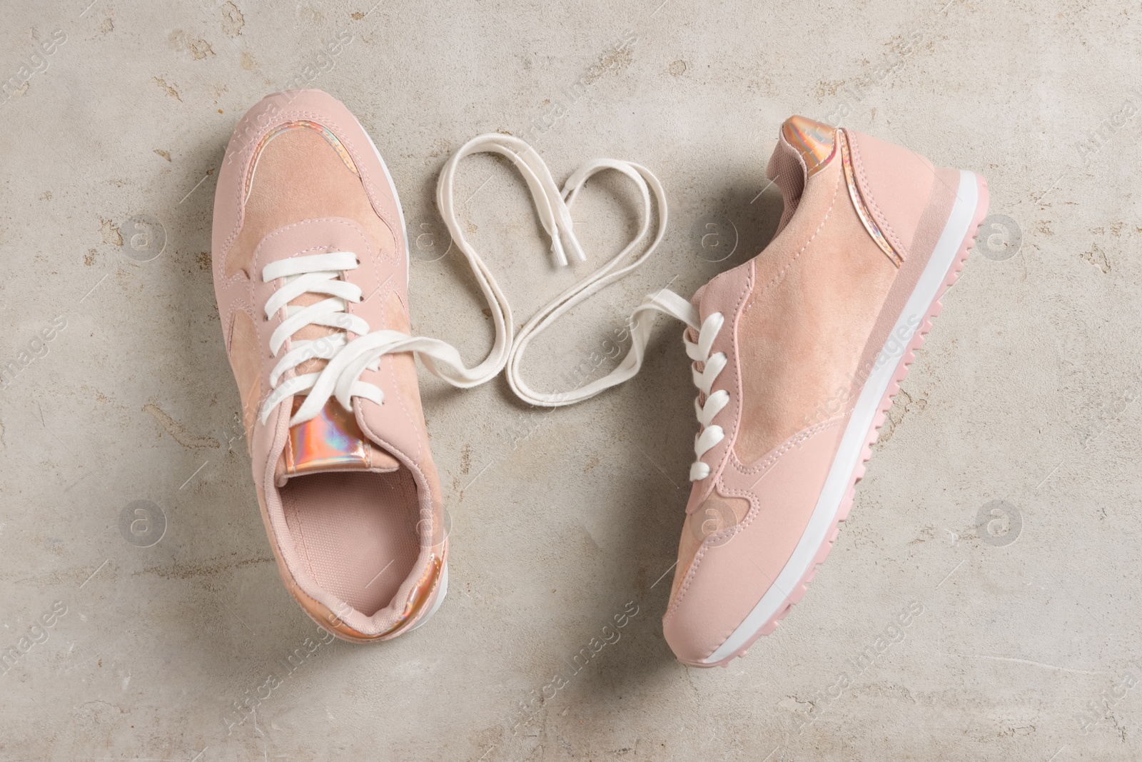 Photo of Pair of stylish shoes with laces on grey background, flat lay