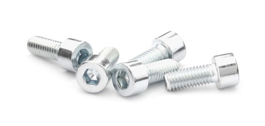 Photo of Metal socket screws isolated on white. Hardware tools