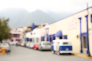 Photo of San Pedro Garza Garcia, Mexico – February 8, 2023: Blurred view of street with cars and beautiful buildings