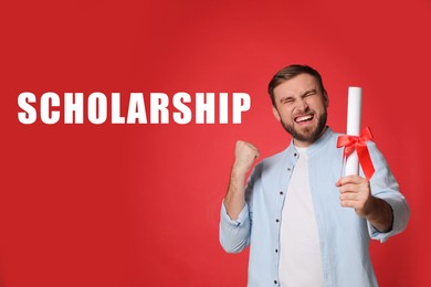 Scholarship concept. Happy student with diploma on red background