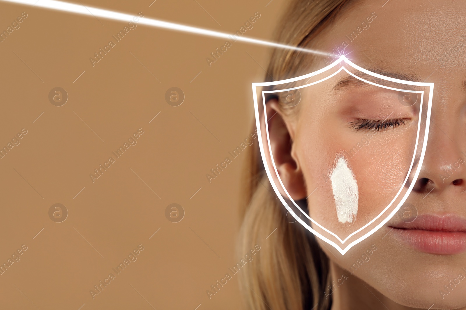 Image of Sun protection care. Beautiful woman with sunscreen on face against beige background, space for text. Illustration of shield as SPF