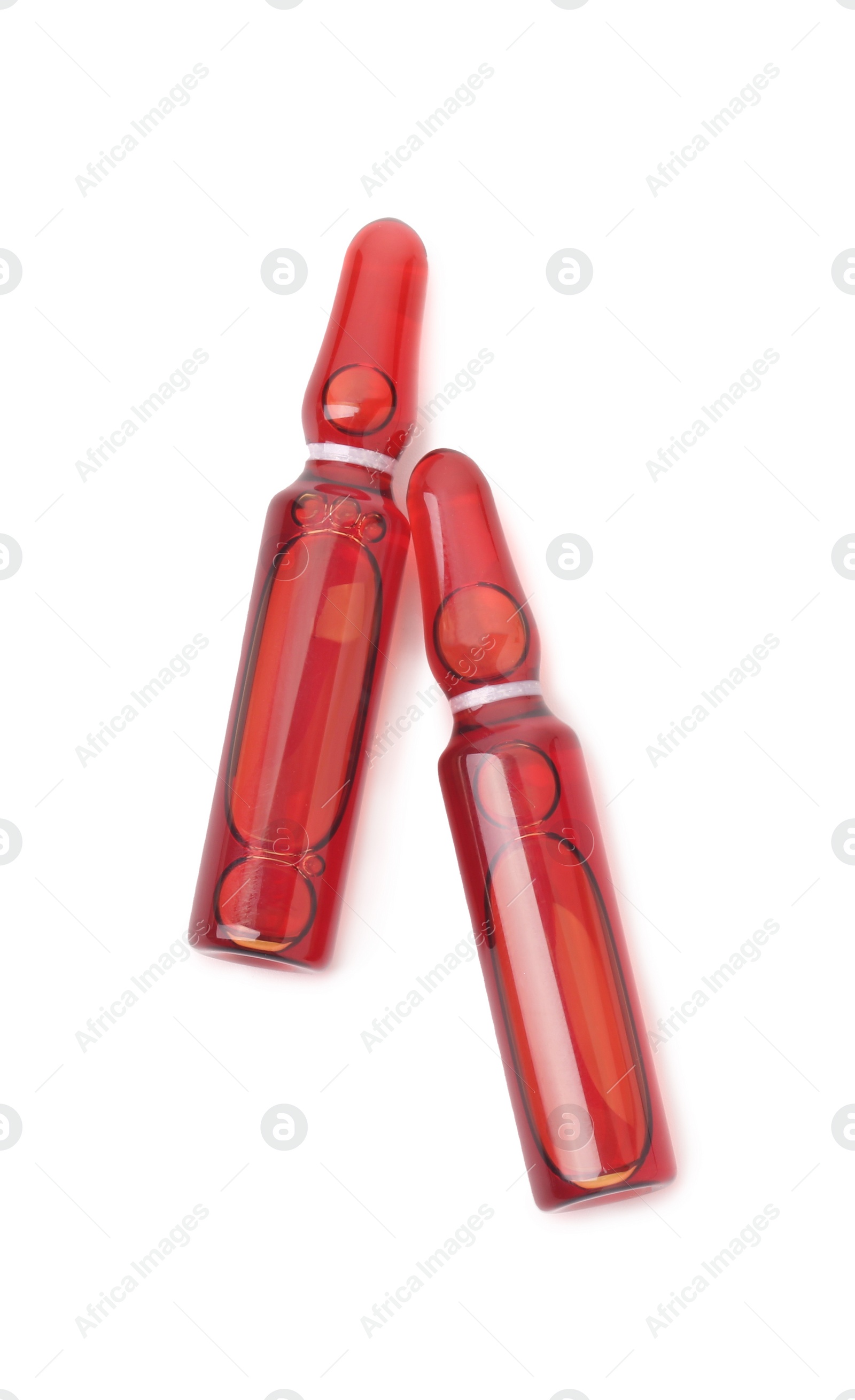 Photo of Glass ampoules with liquid isolated on white, top view