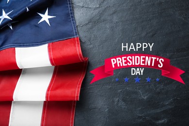 Image of Happy President's Day - federal holiday. American flag and text on black background, top view