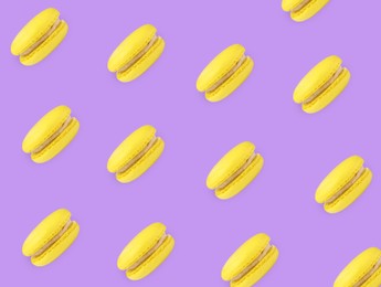 Delicious macarons on violet background, flat lay 