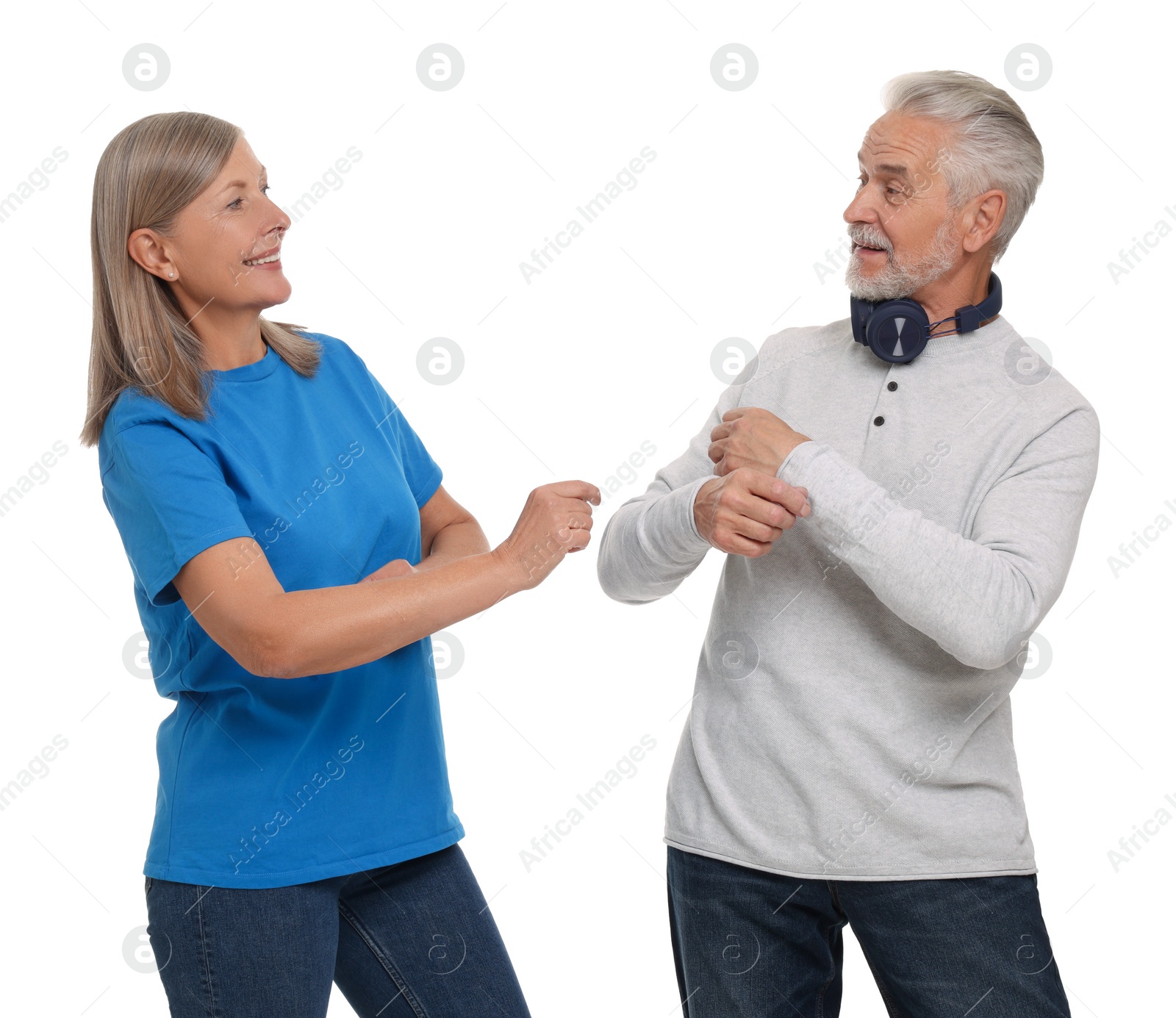 Photo of Senior couple dancing together on white background