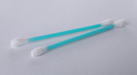 Photo of Clean cotton buds on white background. Hygienic accessory