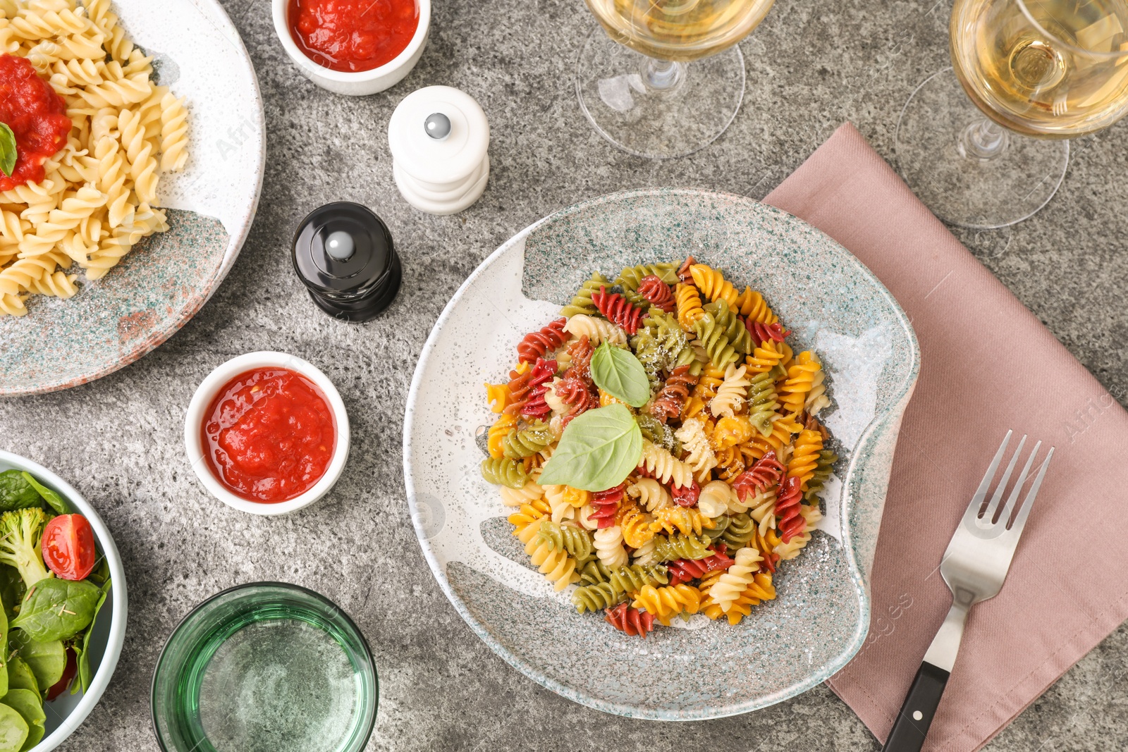 Photo of Flat lay composition with tasty pasta on grey table